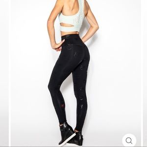 Kadyluxe high rise black leggings w/ paw prints XS